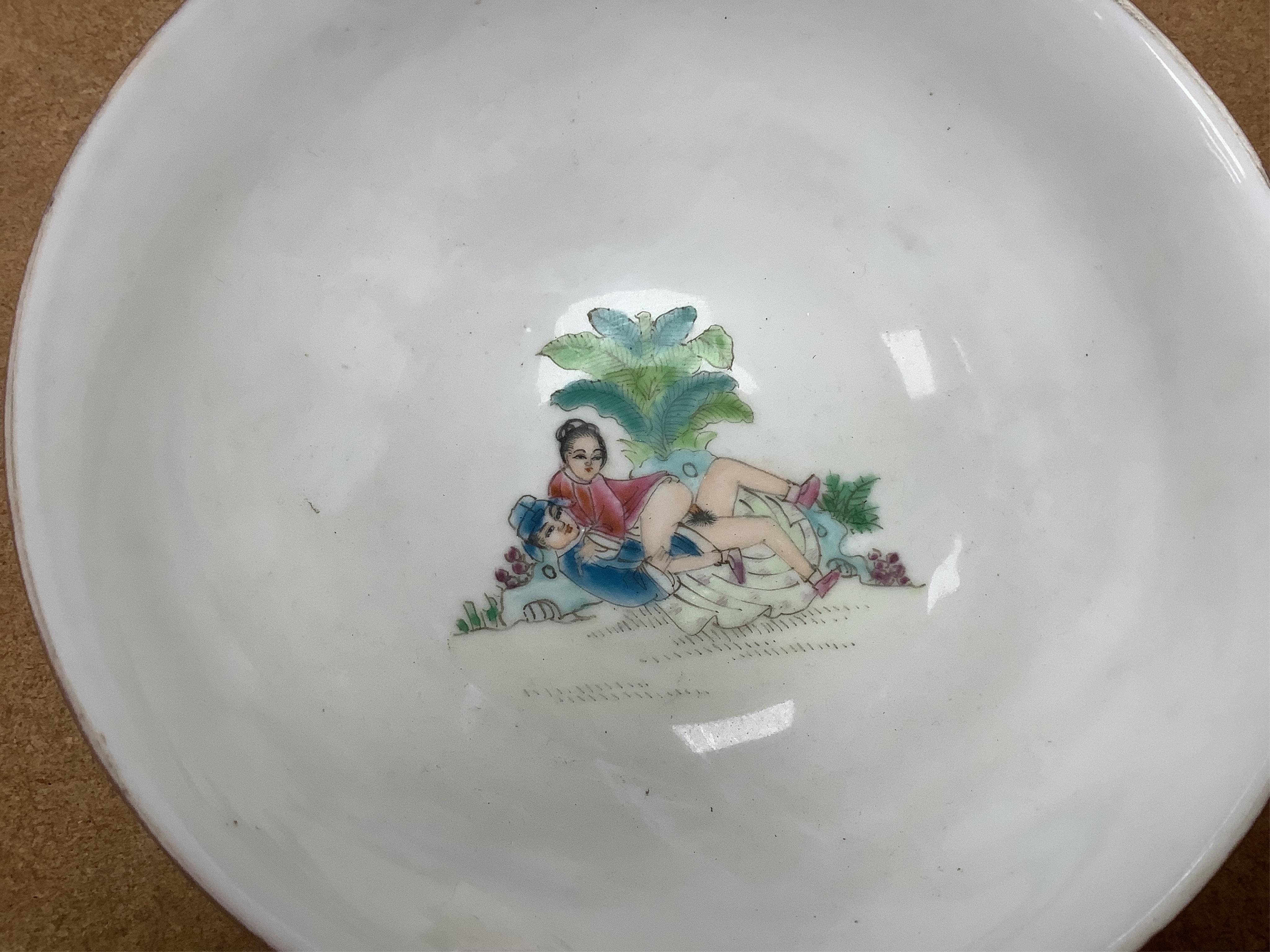 A 20th century Chinese porcelain erotic bowl, and a framed erotic watercolour, bowl 18.5cm diameter